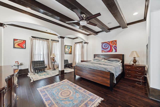 bedroom featuring ceiling fan, beam ceiling, dark hardwood / wood-style floors, and ornate columns