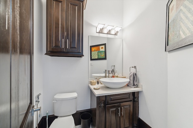 bathroom with toilet and vanity