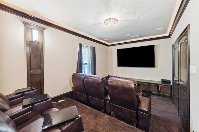 carpeted cinema room with a textured ceiling, crown molding, and a wealth of natural light