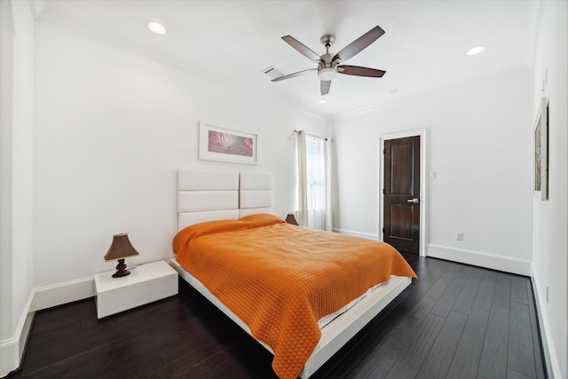 bedroom featuring ornamental molding, ceiling fan, and dark wood-type flooring