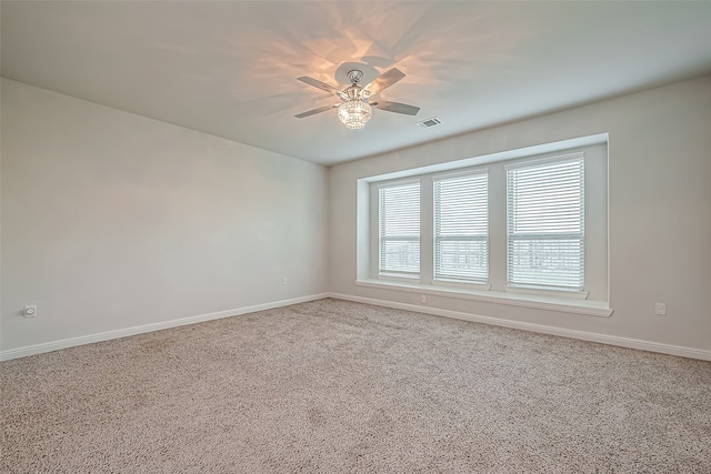 unfurnished room featuring carpet flooring and ceiling fan