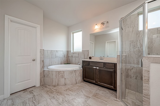 bathroom featuring separate shower and tub and vanity