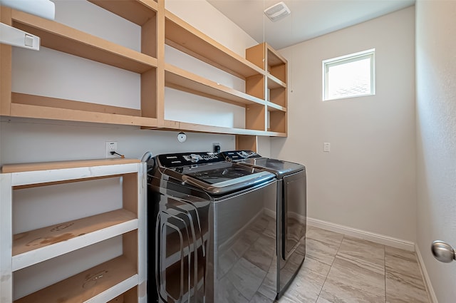 laundry room with separate washer and dryer