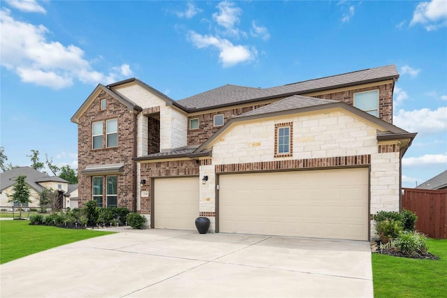 view of front of house with a garage and a front lawn