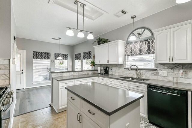 kitchen with white cabinets, dishwasher, a center island, sink, and stainless steel range with gas stovetop