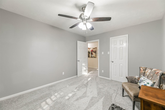 unfurnished room featuring ceiling fan and light colored carpet