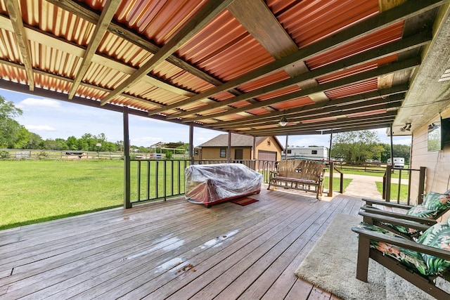 wooden deck with a yard and area for grilling