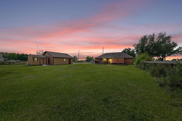 yard at dusk with an outdoor structure