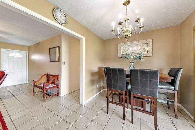 1410 Hovas Ln, Brookshire, TX 77423 - dining room with baseboards, an inviting chandelier, a textured ceiling, and light tile patterned flooring