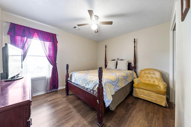 bedroom with hardwood / wood-style flooring, ceiling fan, and a closet