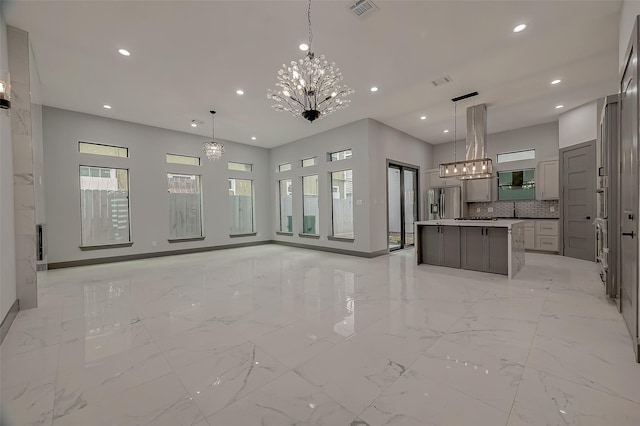2322 Tuam, Houston, TX 77004 - unfurnished living room with a chandelier, recessed lighting, and light marble finish flooring
