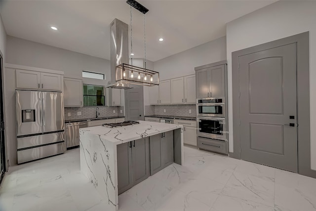 2322 Tuam, Houston, TX 77004 - kitchen featuring stainless steel appliances, a kitchen island, light stone countertops, decorative backsplash, and recessed lighting