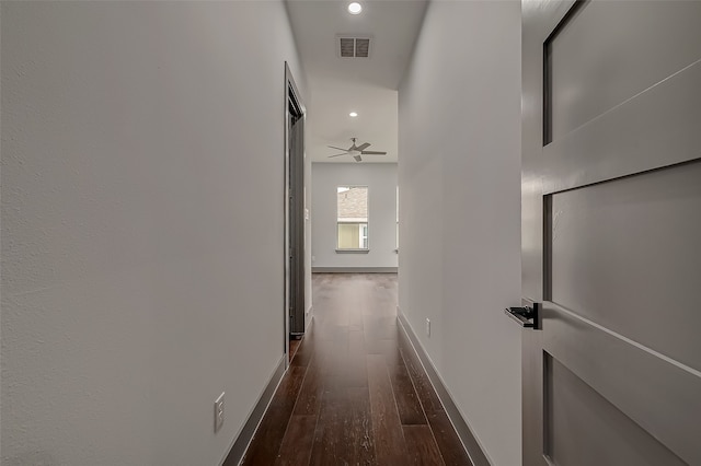 hall featuring dark wood-type flooring