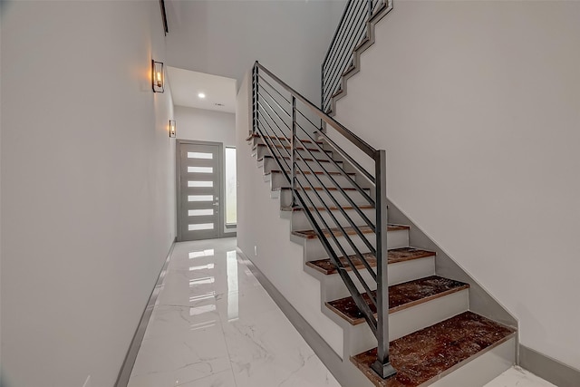 2322 Tuam, Houston, TX 77004 - stairs featuring marble tiled floors and recessed lighting
