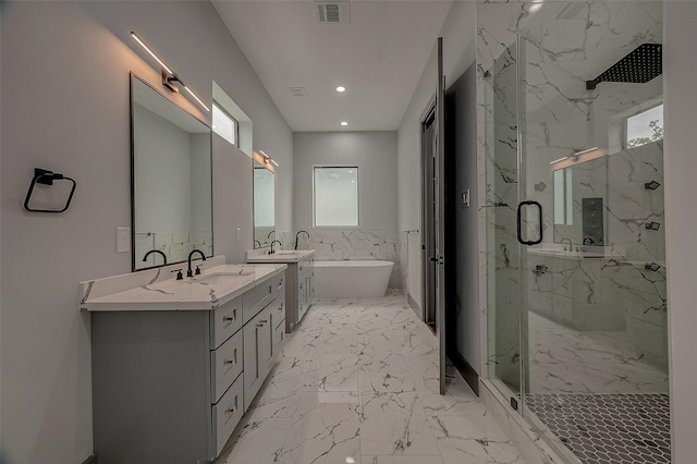 2322 Tuam, Houston, TX 77004 - bathroom with a marble finish shower, a soaking tub, double vanity, marble finish floors, and recessed lighting