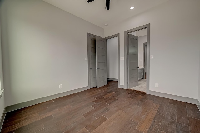 2322 Tuam, Houston, TX 77004 - unfurnished bedroom with dark wood-style flooring and recessed lighting
