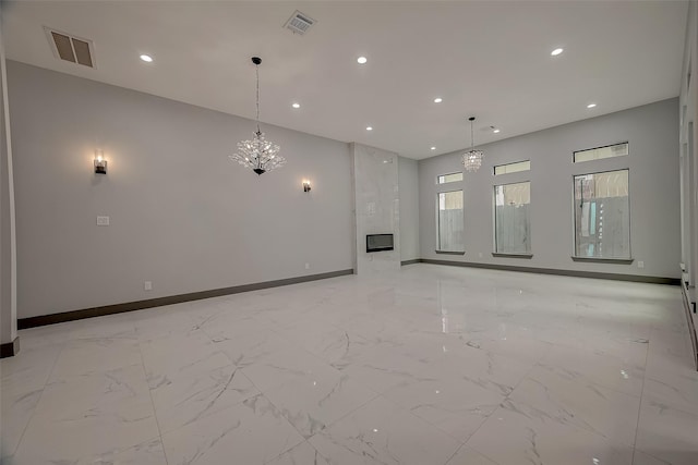 2322 Tuam, Houston, TX 77004 - unfurnished living room featuring recessed lighting, a chandelier, and light marble finish flooring
