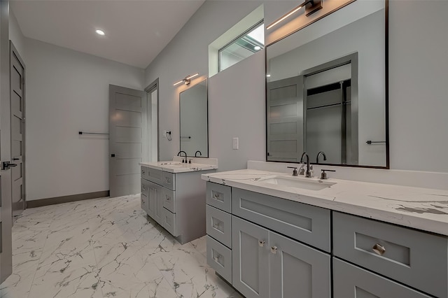 2322 Tuam, Houston, TX 77004 - full bath with marble finish flooring, two vanities, and recessed lighting