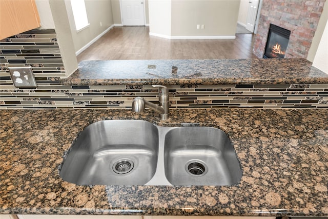 interior details with dark stone counters and sink