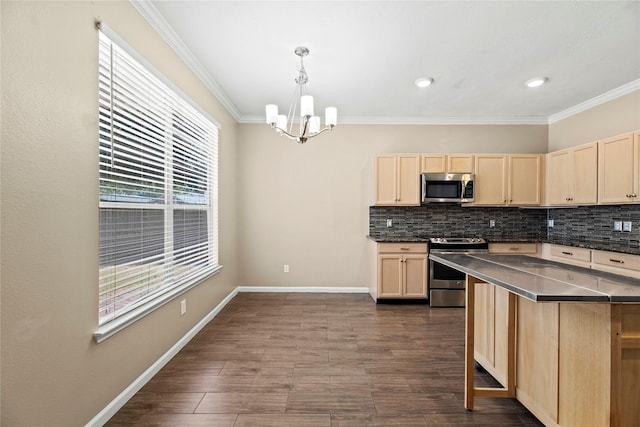 kitchen featuring stainless steel appliances, tasteful backsplash, light brown cabinetry, hanging light fixtures, and ornamental molding