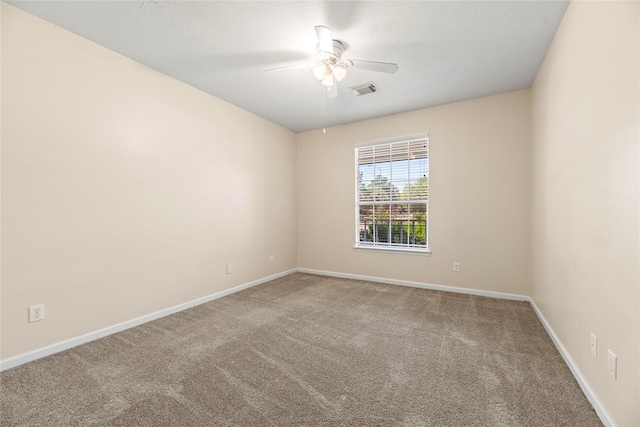 carpeted empty room with ceiling fan