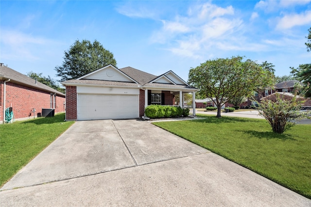 ranch-style home featuring a front lawn and a garage