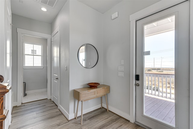 doorway to outside featuring light wood-type flooring