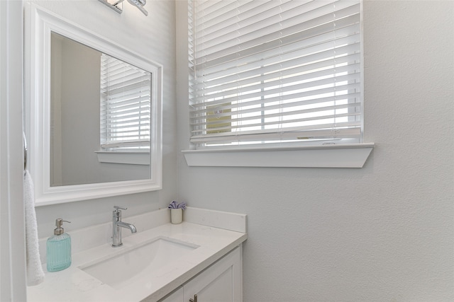 bathroom with a wealth of natural light and vanity