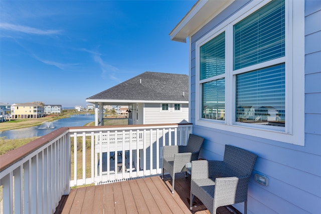 wooden deck featuring a water view