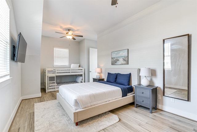 bedroom featuring light hardwood / wood-style flooring and ceiling fan