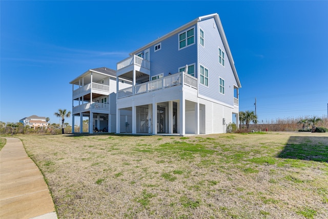 rear view of house with a lawn