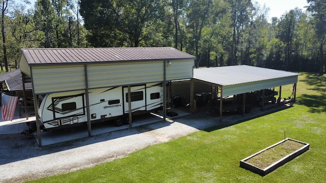 exterior space featuring a lawn and a carport