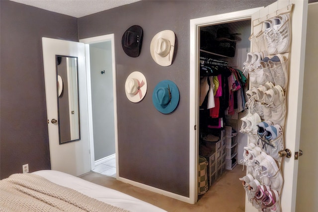 carpeted bedroom with a closet