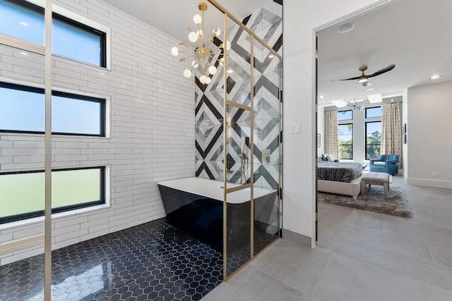 bathroom featuring brick wall, separate shower and tub, ceiling fan with notable chandelier, and concrete flooring