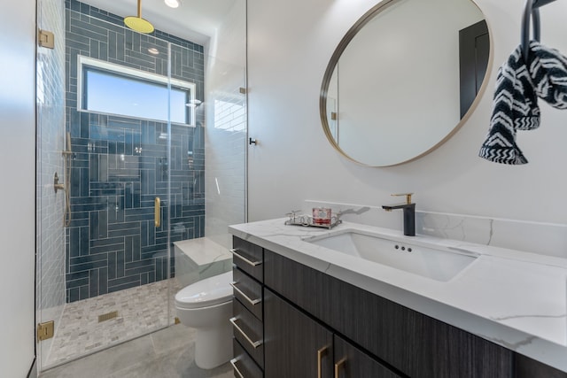 bathroom featuring an enclosed shower, tile patterned floors, vanity, and toilet