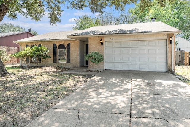 single story home featuring a garage