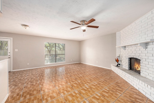 unfurnished living room featuring a fireplace, plenty of natural light, and a textured ceiling