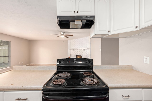 kitchen with ceiling fan, black electric range oven, backsplash, white cabinetry, and a fireplace