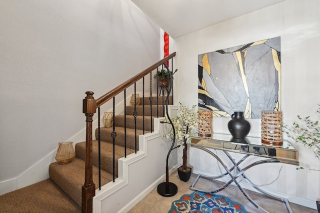 stairs with tile patterned flooring