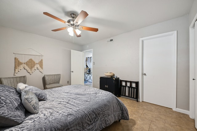 bedroom featuring ceiling fan and light tile patterned floors