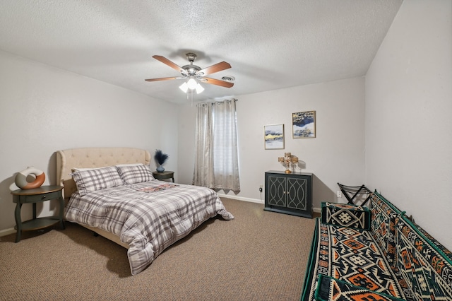 carpeted bedroom featuring a textured ceiling and ceiling fan