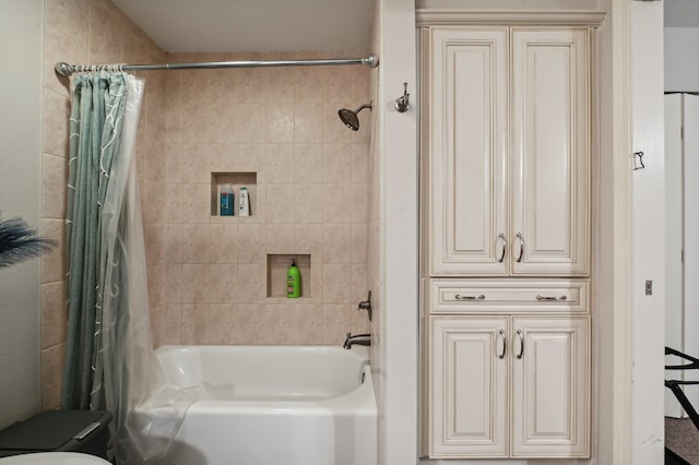 bathroom featuring shower / bath combination with curtain and toilet