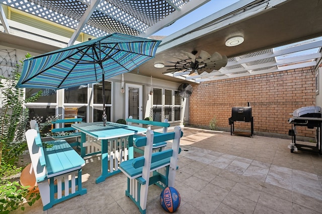 view of patio featuring ceiling fan, a pergola, and a grill