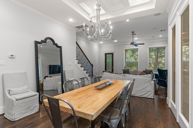 dining space featuring ceiling fan with notable chandelier, ornamental molding, and dark wood-type flooring