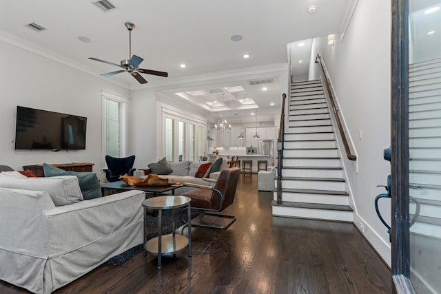 living room with crown molding, ceiling fan with notable chandelier, and dark hardwood / wood-style floors