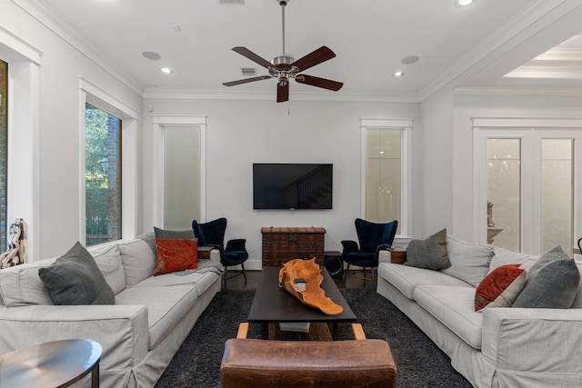 living room featuring ceiling fan, crown molding, and dark wood-type flooring