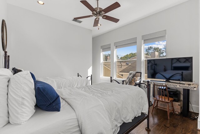 bedroom featuring ceiling fan and dark wood-type flooring