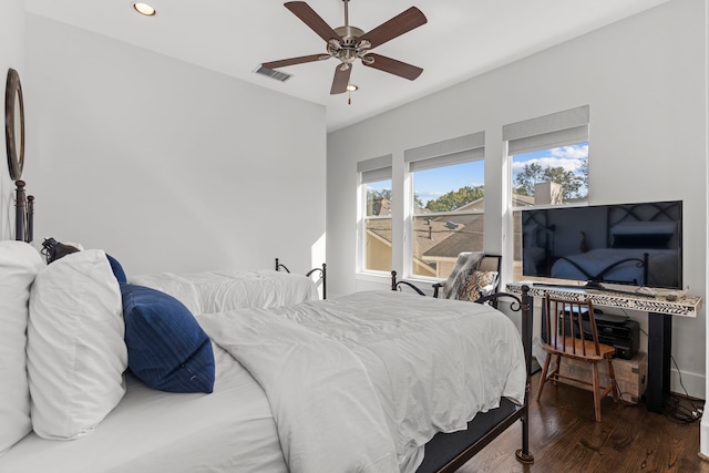 bedroom featuring ceiling fan and dark hardwood / wood-style floors