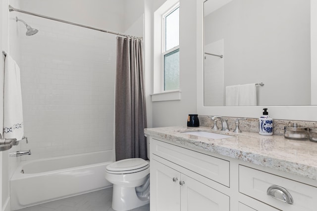 full bathroom with vanity, toilet, and shower / tub combo