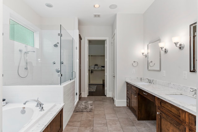 bathroom featuring tile patterned floors, vanity, and independent shower and bath